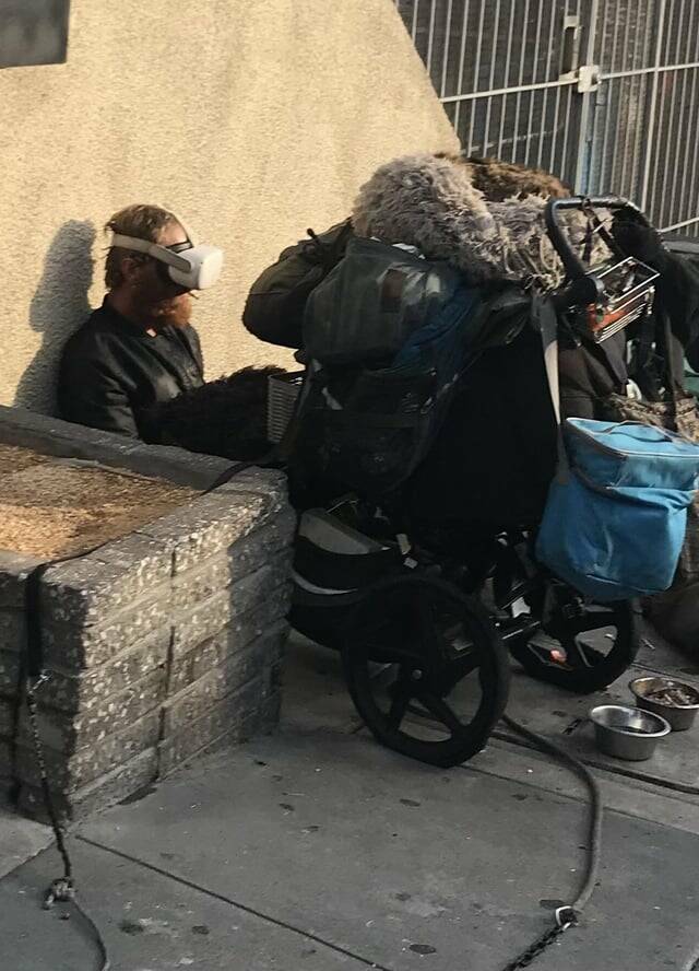 "Homeless man in Silicon Valley with VR headset"