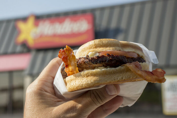 A while back, I won $2,000 cash, an Xbox, and a year's supply of Hardee's burgers in a Burnout Revenge tournament. The free Hardee's came in the form of 52 vouchers for free burgers. I worked as a porter at a car dealership at the time, and there was a Hardee's right next door to the gas station where we would fill up the new cars once they were sold. Naturally, I would swing through and redeem my vouchers pretty regularly. One day, I filled up a new Civic, went through the drive-through, came back to work, delivered the car, had my lunch, and went about my day. On my way home, I realized I left my burger booklet in the center console of the car. Someone went home with a new car and about 30 free burgers.