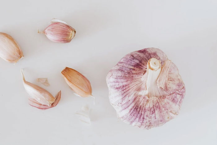 If you rub garlic on your feet you can taste it.