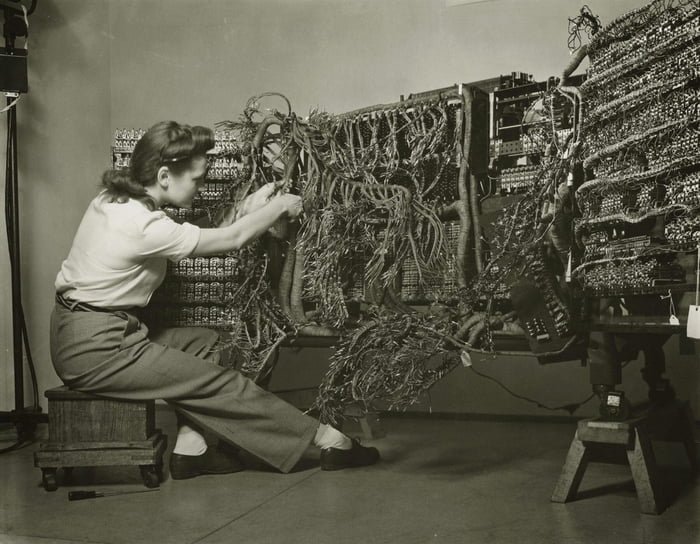 fascinating historical photos - engineer wiring an ibm computer - www