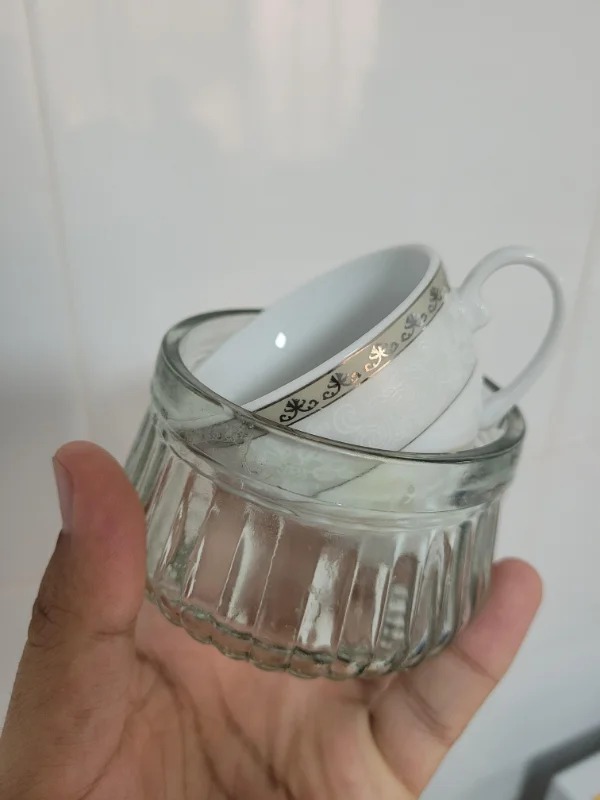 “I was cleaning my kitchen and found this nice tea cup stuck in this glass and can’t remove it.”