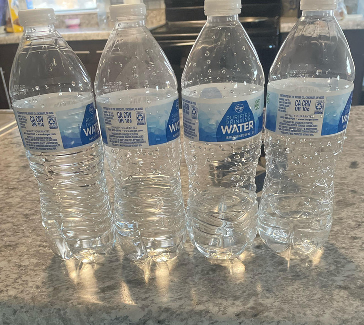 people having a bad day - bottled water - W'Orici Ca Crv Or 10 Quality Guarantee Pur Wate Hcrna, De Ca Crv Or 10c Duality Guarantli We Problete Wenget, Upa Pu Wa ww Og C110 Drinking Water I www $ Korey 0752 E Used By Of The Gero, Concomat, Of S Ca Crv Or 