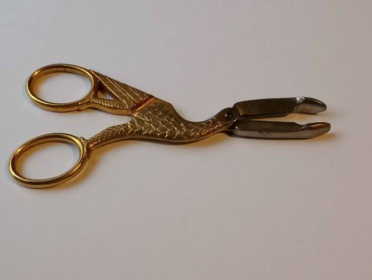 odd items with simple explanations - antique stork umbilical clamp