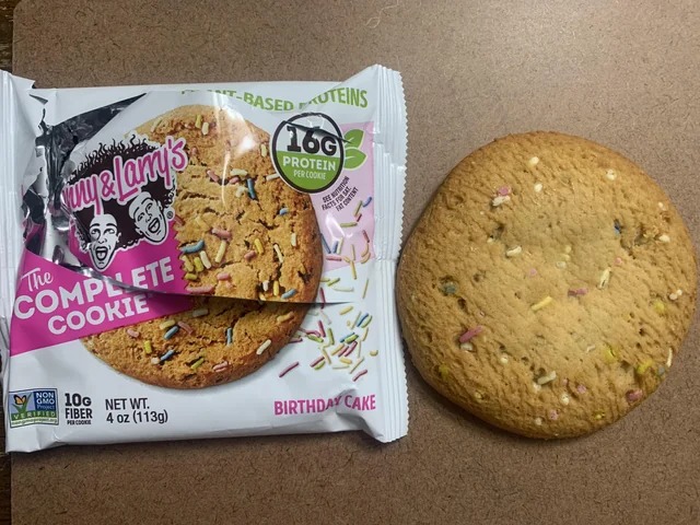 expectations vs reality - cookies and crackers - Stimme Larry's The Complete Cookie No 10G Net Wt. Fiber 4 oz 113g Projec Per Cook Verified TBased Uteins 166 Protein Per Cookie Fact Ear Birthday Cake