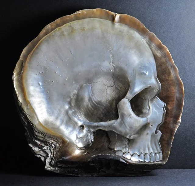 Skull carved into mother of pearl