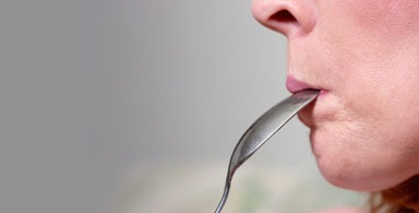 Don't put a spoon in the mouth of a person having a seizure.