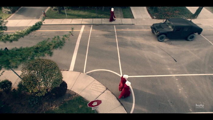 In The Handmaid's Tale, The Stop Signs Have A Hand Signal Instead Of The Word "Stop" Because The Women Are Not Permitted To Read