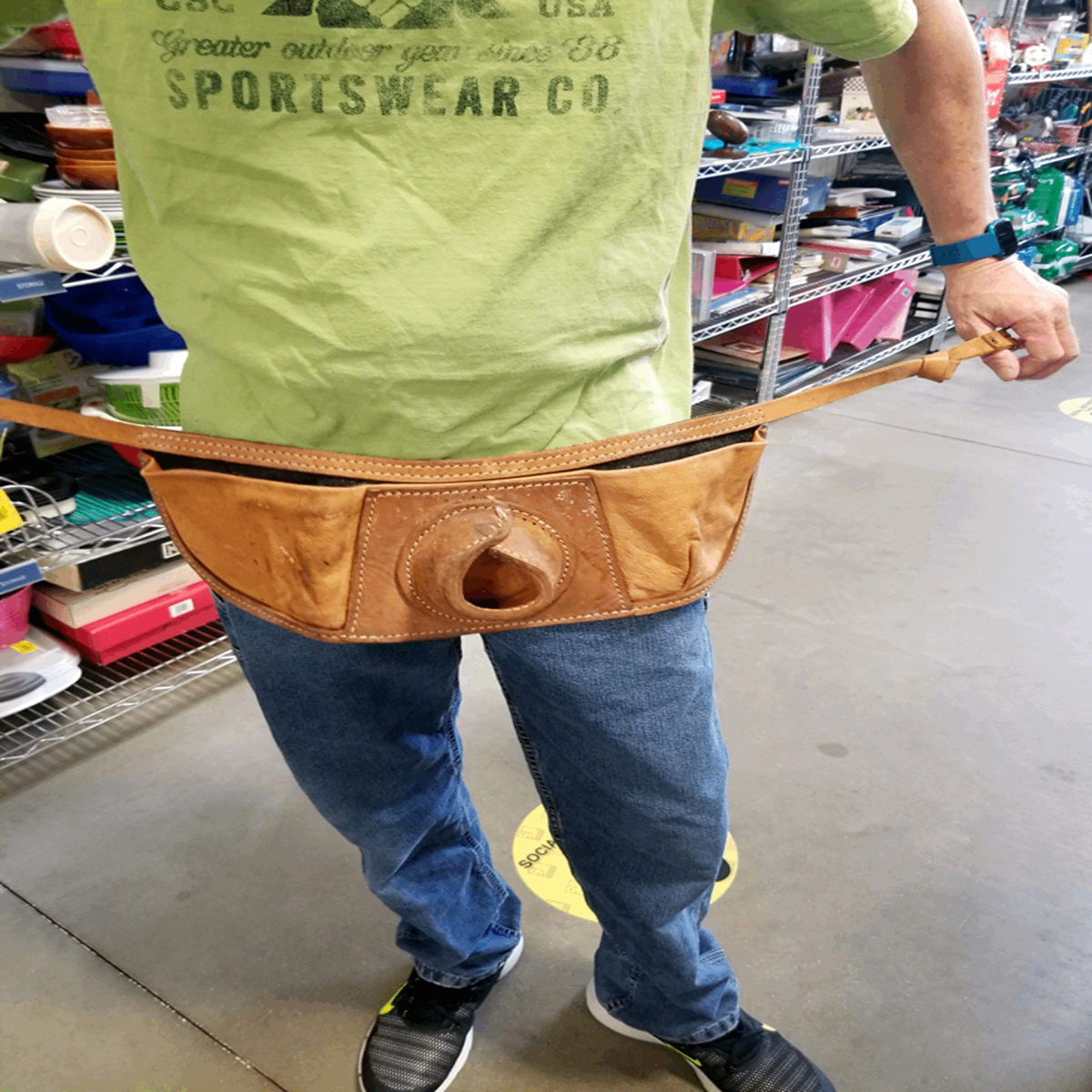 Friend found at a Goodwill. Tool belt of some kind. Does anyone know the specific use? Answer: A fishing pole holder.