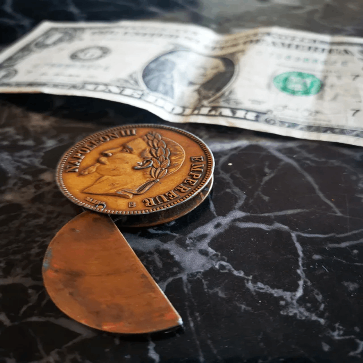 Found in an unfinished basement of an old home. Looks like a coin but it’s hollow and opens up. Answer: A coin lighter with the cool lighter part missing so it just looks like a weird hollow coin.