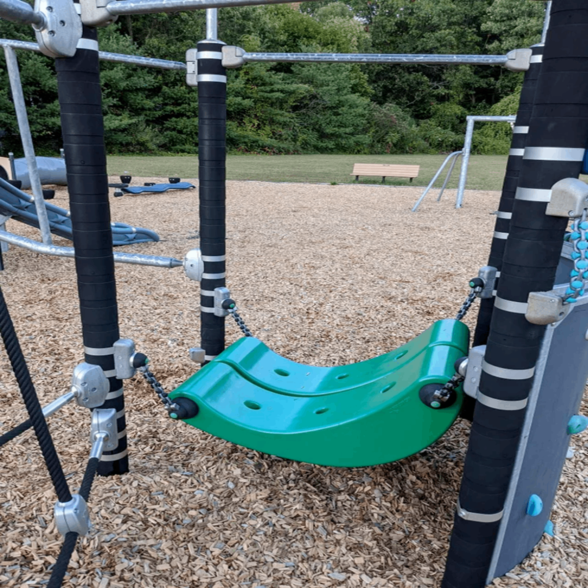 What is this piece of playground equipment for? Seems like it must have a function other than to just lay on it. Answer: it’s a space for children in wheelchairs to access the playground space so they don’t feel left out. Beautiful.