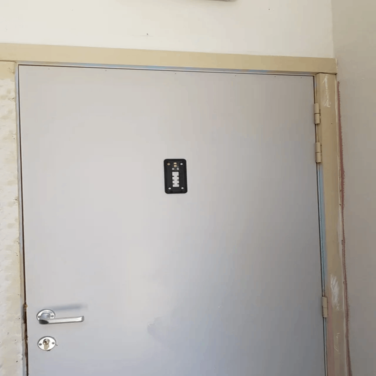 Black square thing on the door with white in the middle and what seems to be data chips on the top on the door? Don’t recall this being there yesterday. Any ideas? Answer: Mounting plate for a Ring camera. Stay safe out there.