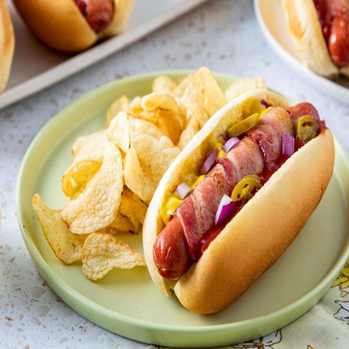 Hot dog condiments on the bun first, then put the hot dog on top.