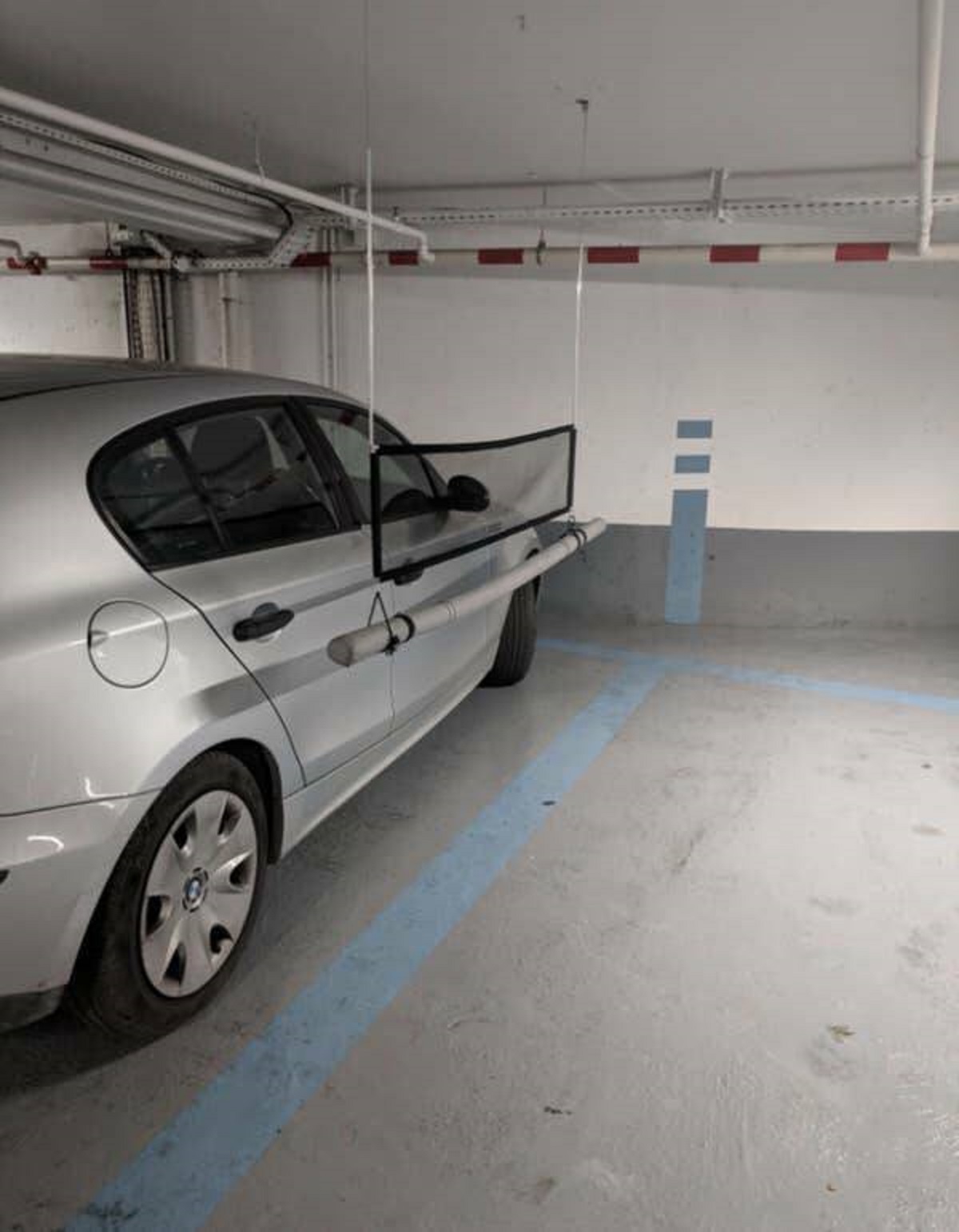 In France, there are parking garages with these neat little dividers to stop people from accidentally denting or scratching the car next to them when they get out.