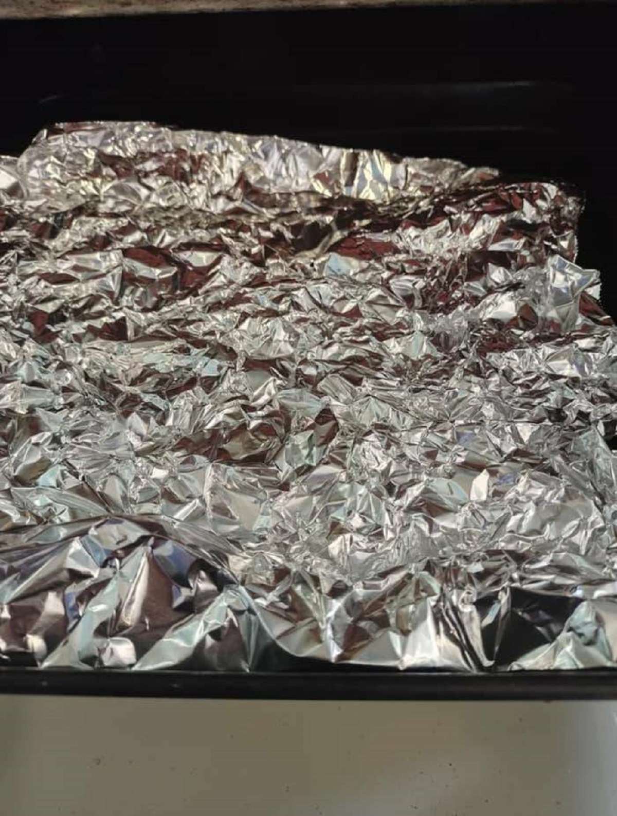 "Crinkle your foil before making chicken nuggets, frozen potatoes, etc. It makes for easy flipping and helps the food to not get stuck. I discovered this by accident/being cheap. Hope it helps somebody out there!"