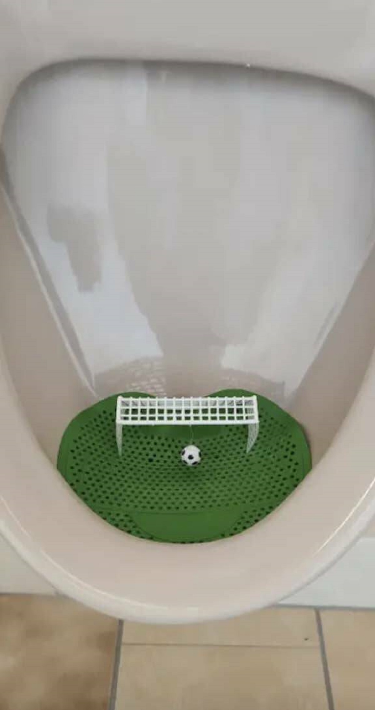 This doesn't necessarily apply to me, but this German restaurant has made peeing fun by including a mini soccer game in urinals.