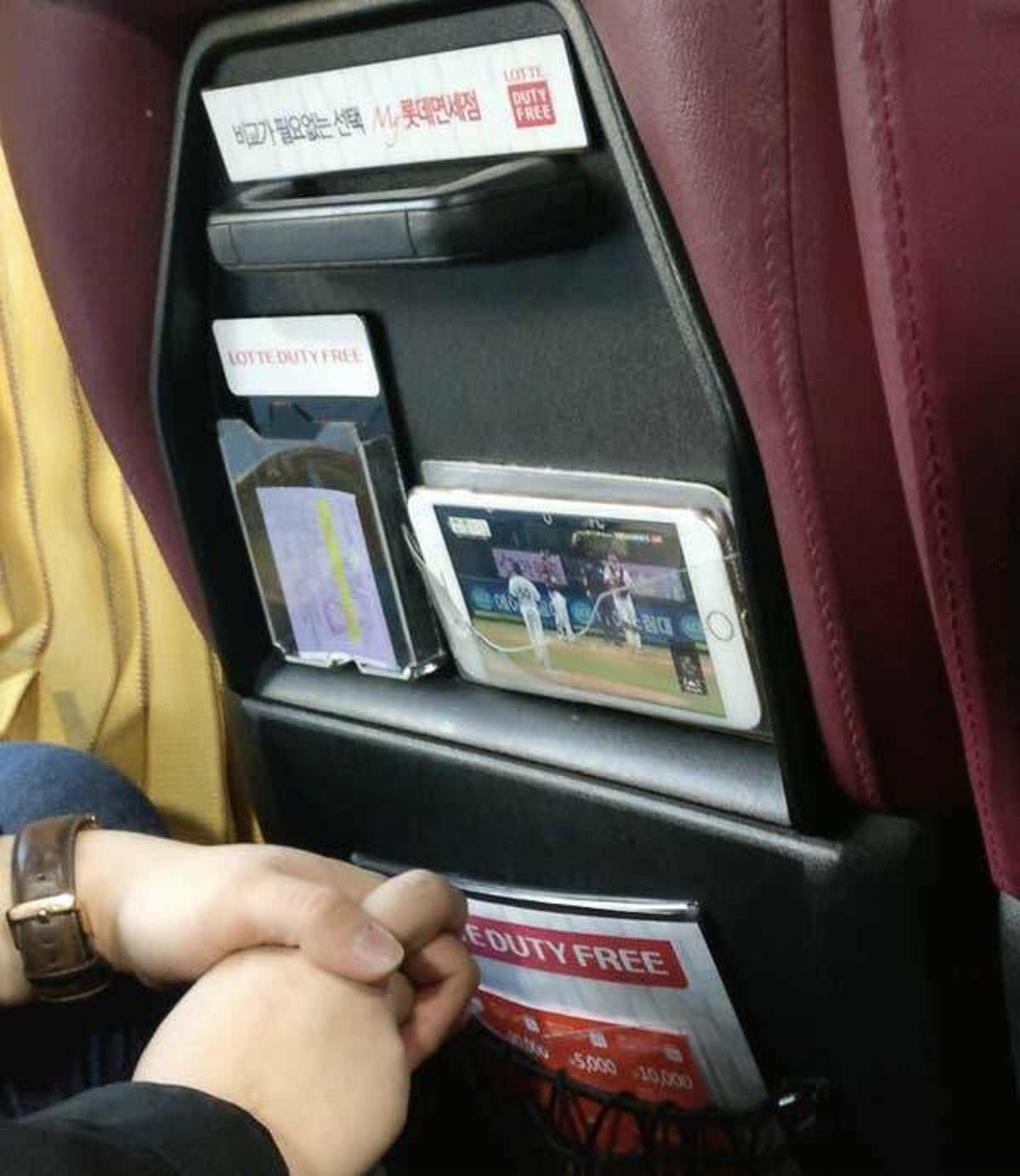 Seoul buses have transparent pockets so you can watch something on your phone while keeping it secured and protected....and not even having to hold it.