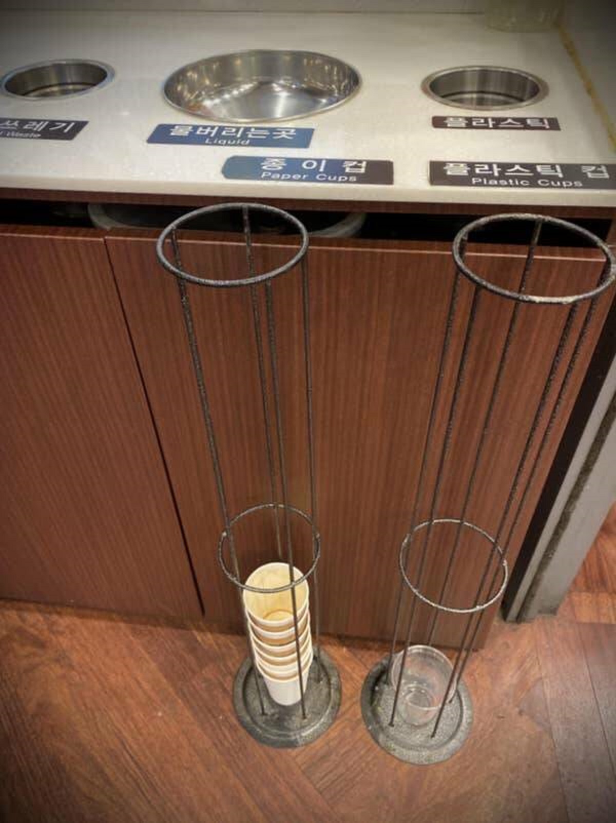 In some Korean coffee shops, there are slots to put your used cups so they can easily be recycled and don't take up too much space in the trash.