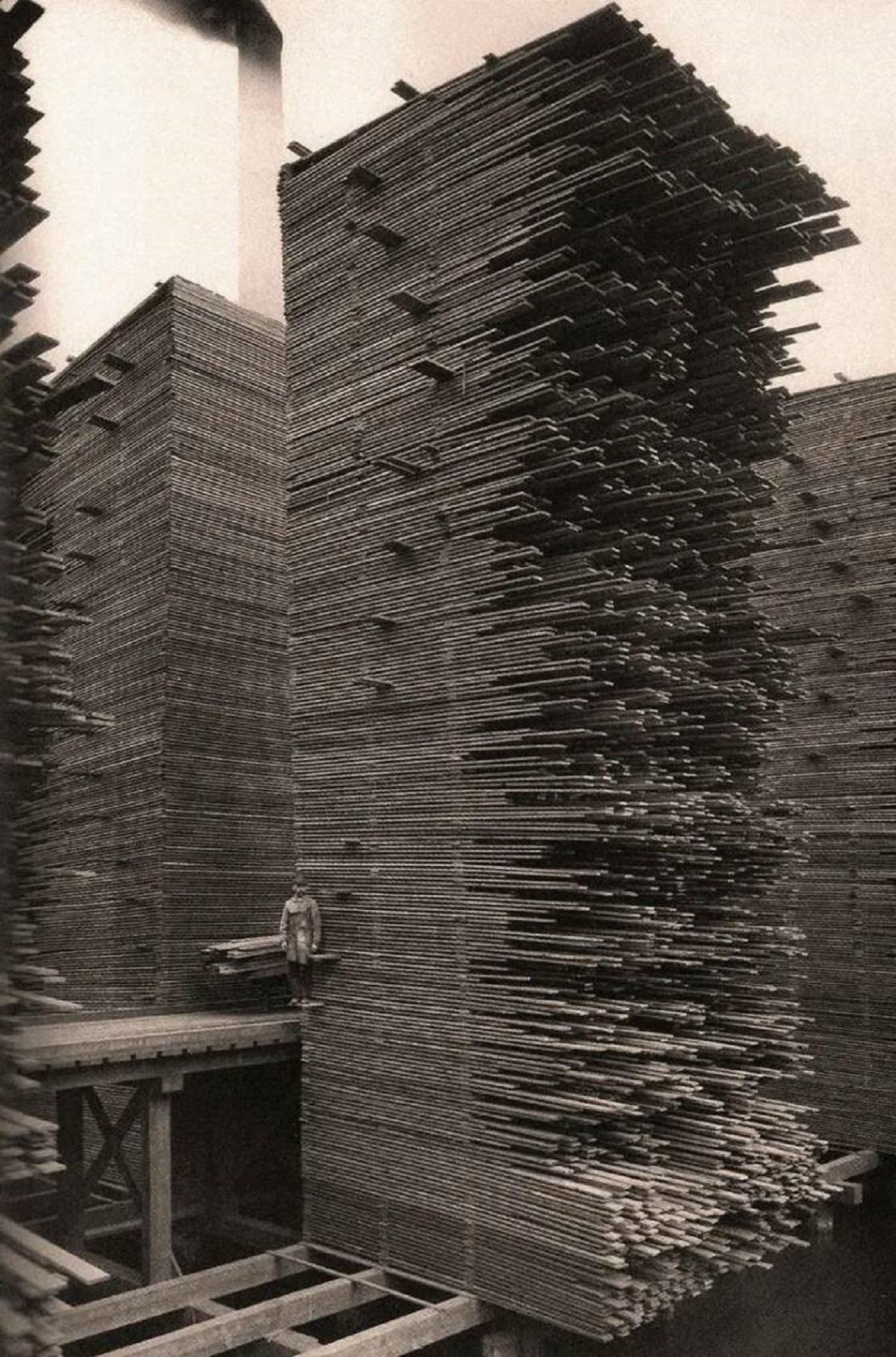 This photo from a Seattle lumberyard in 1919 show just how high stacks of lumber could go in those days: