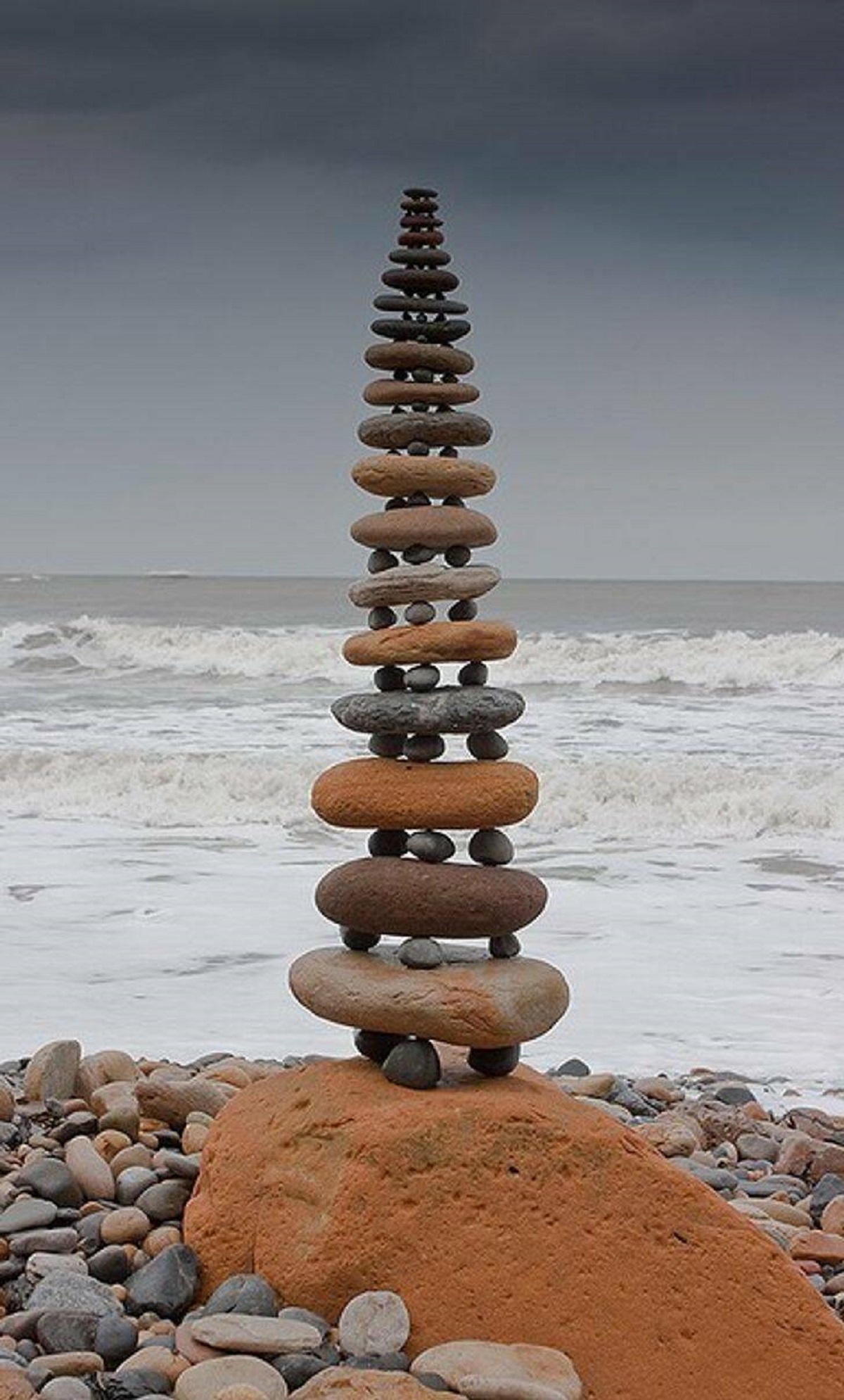 A rock tower balanced on little rocks that creates the illusion of a stairway
