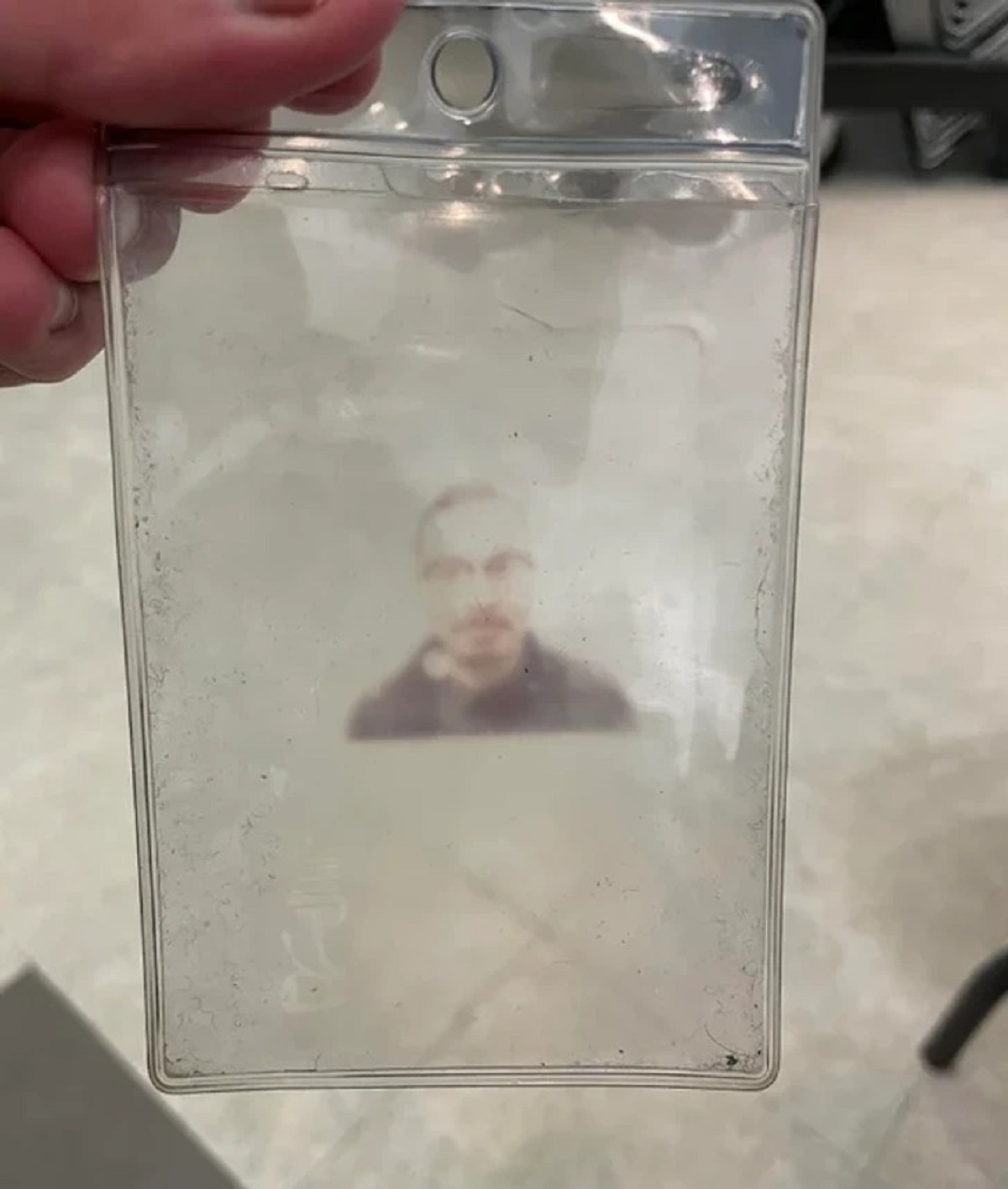 “My work ID has been in its plastic holder for so long that it imprinted this ghostly image of my face.”