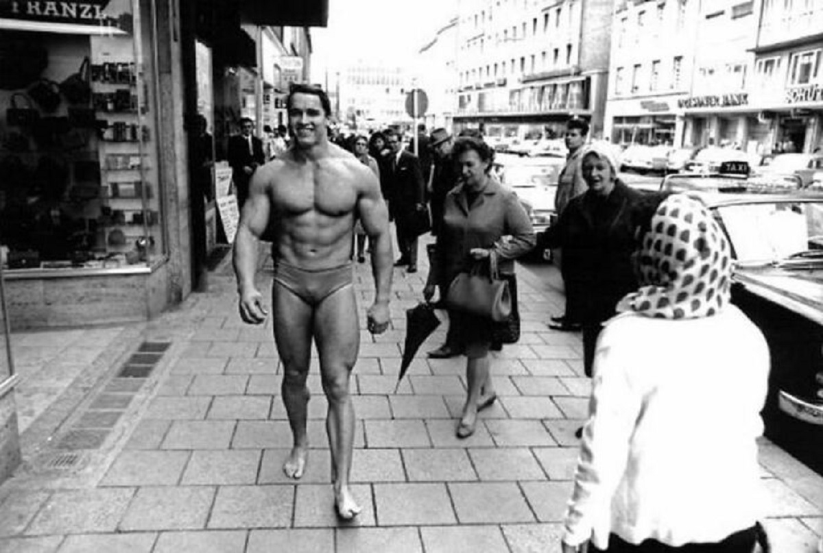Pictures Of Arnold Schwarzenegger Walking Through Munich In Swimming Trunks In Order To Promote His Own Gym, 1967