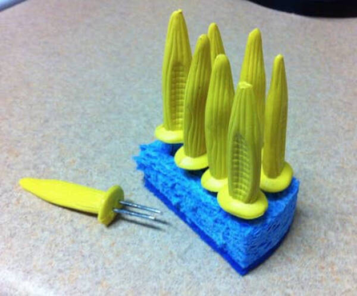 "Finally figured out how to store those pesky corn cob holders. No more poking myself in the kitchen drawer."