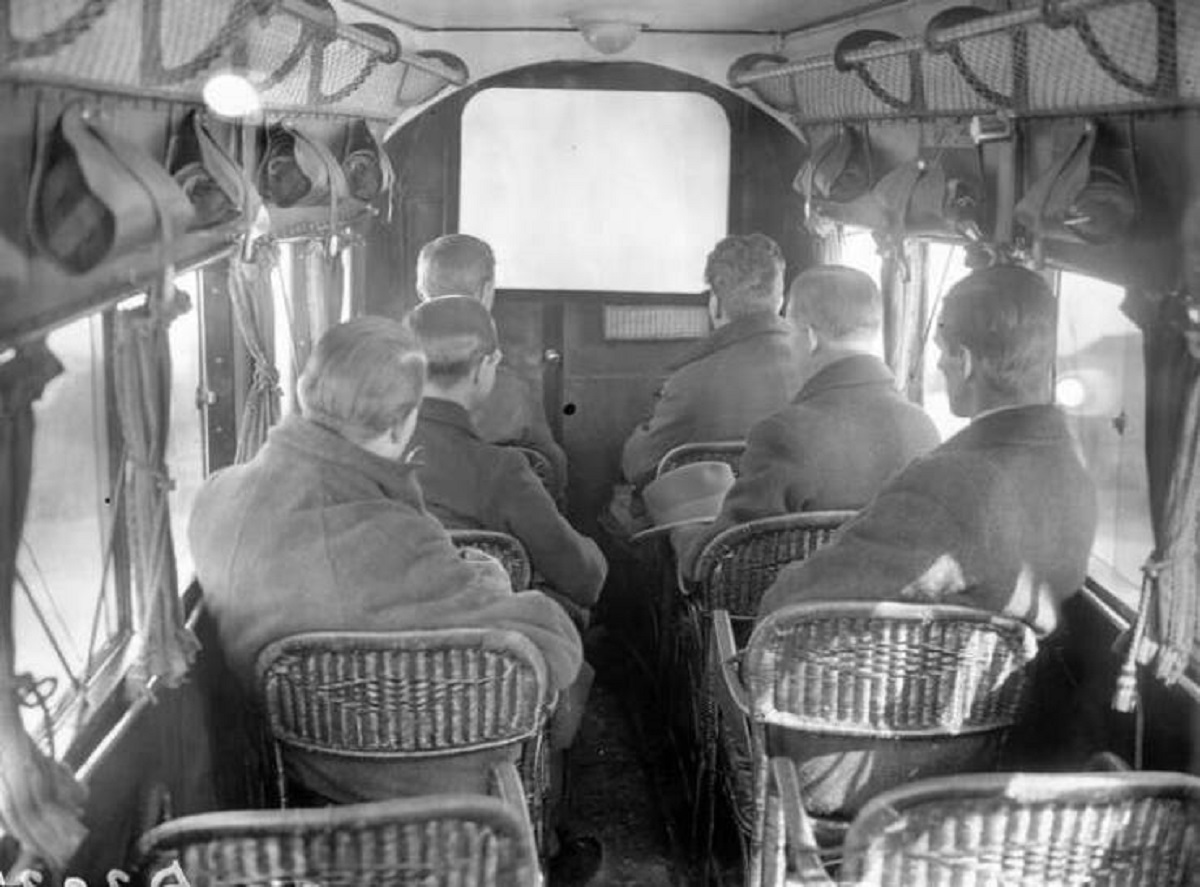 This picture, taken in 1925, shows the passengers on an Imperial Airways flight watching one of the first in-flight movies ever:

They're watching a silent film called The Lost World
