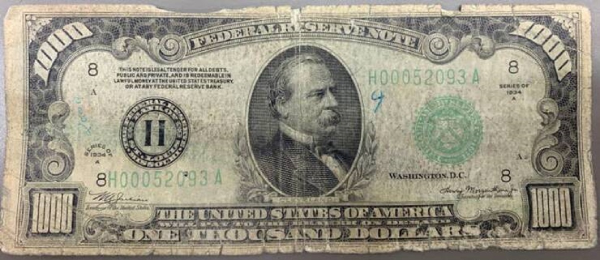 This is what a $1,000 bill looks like:

It was first put into circulation in 1928. That's Grover Cleveland's big mug on the front.