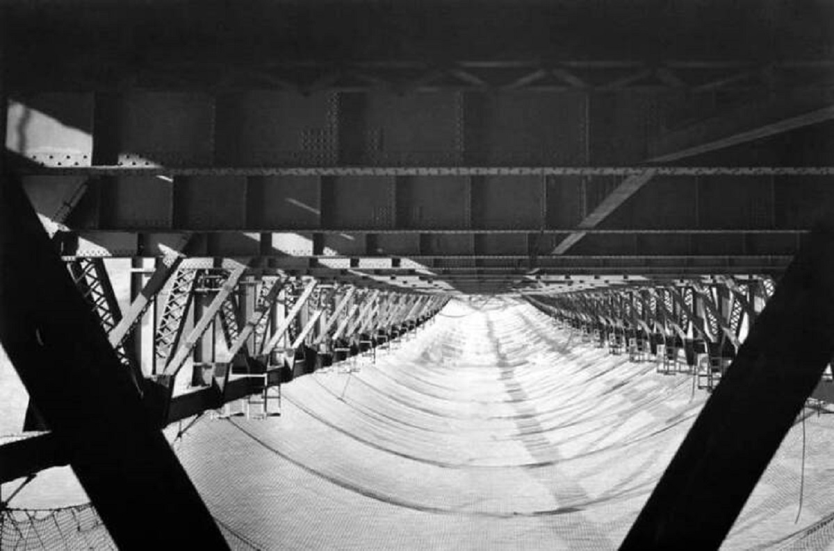 This is the safety net that was installed under the Golden Gate Bridge during its construction in the 1930s. The net saved 19 people through the duration of the work:

The 19 men who were saved by the net became known as the "Halfway to Hell Club."