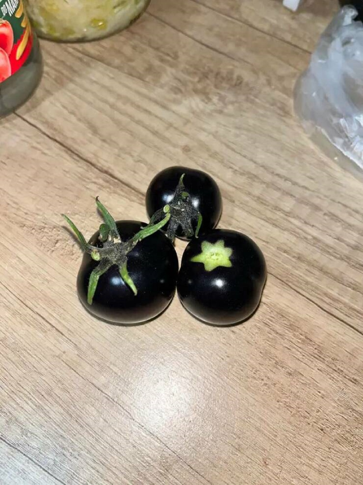 Black tomatoes exist:

It's a strain called "black beauty" and is apparently "rich, smooth, and savory with earthy tones."