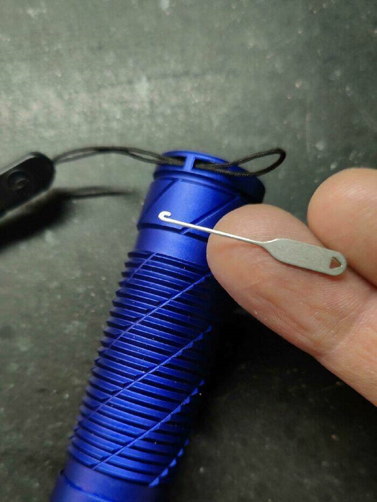 "A Little Hook Tool To Pull Through Those Tiny Little Straps That Come With A Lot Of Devices"