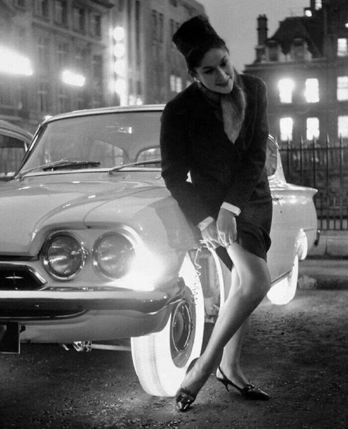 "Goodyear’s Illuminated Tires - A Woman Adjusts Her Stocking Using The Light Emitted By The Goodyear Tire On An October Night In 1961"