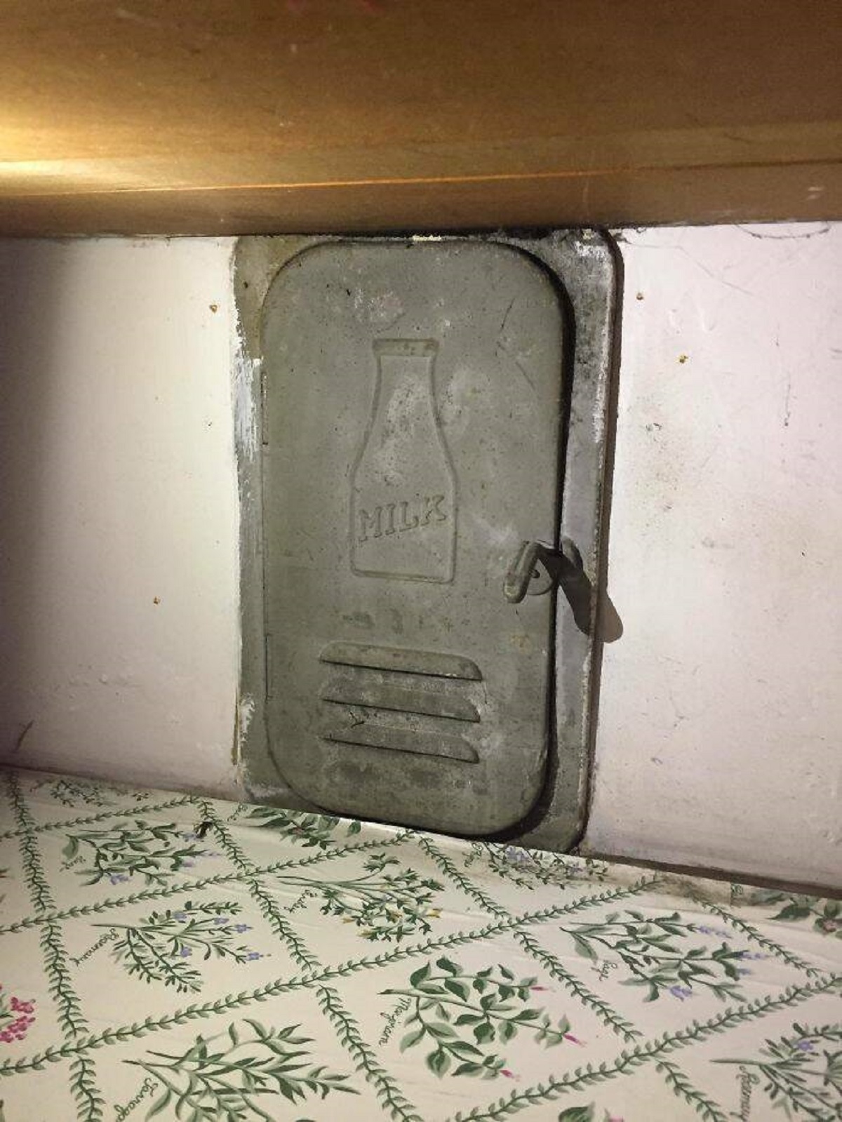 "Our New Apartment Has A Little Milk Door Under The Cabinets"