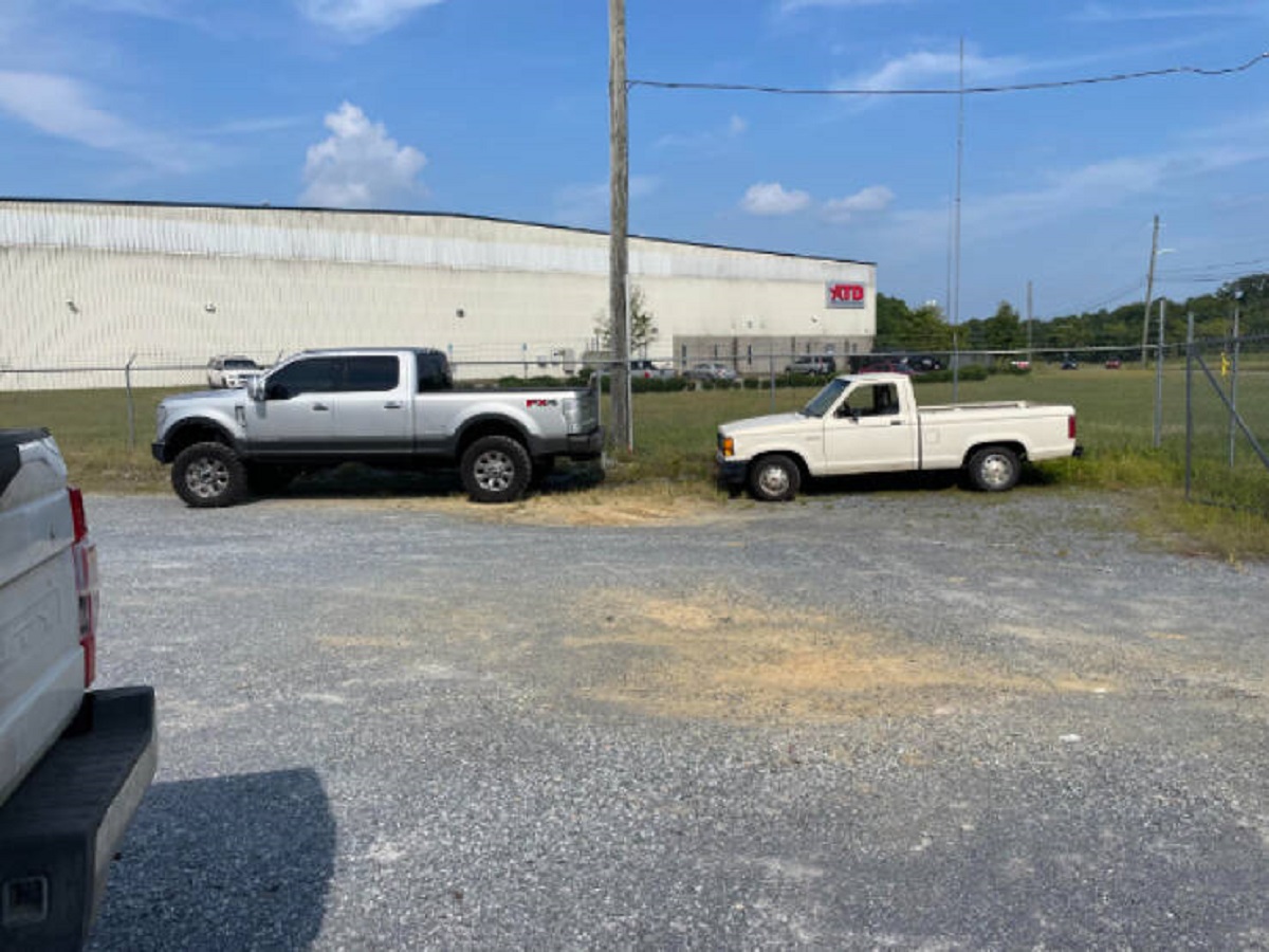 “My Ford Ranger compared to my coworkers Ford F350. My truck is the height of his windows”