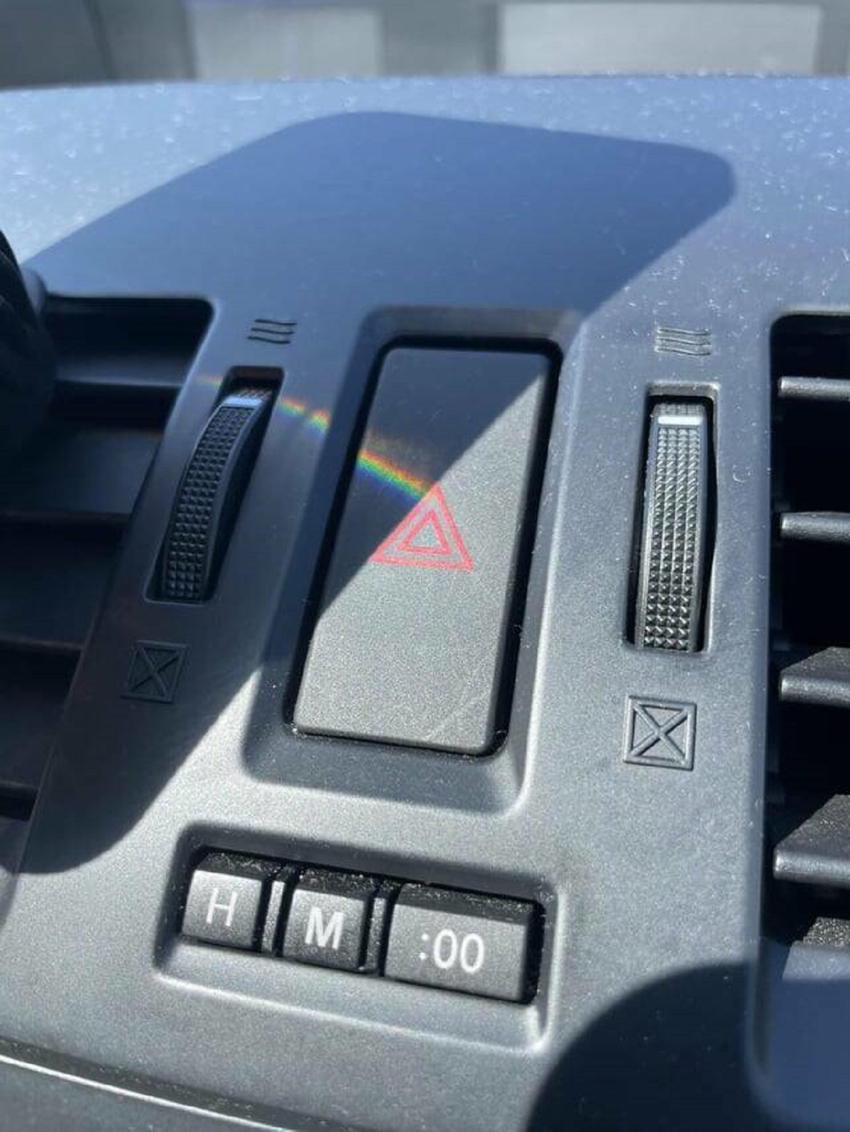 "A reflection from my friend’s phone created a Pink Floyd album cover on her hazard button"