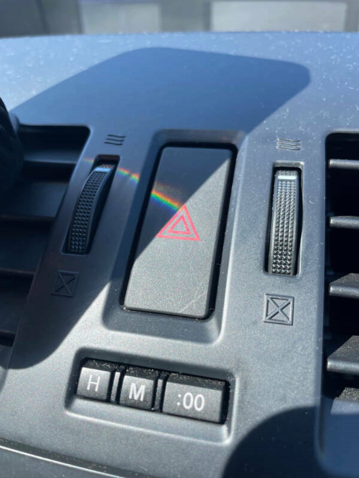 “A reflection from my friend’s phone created a Pink Floyd album cover on her hazard button”