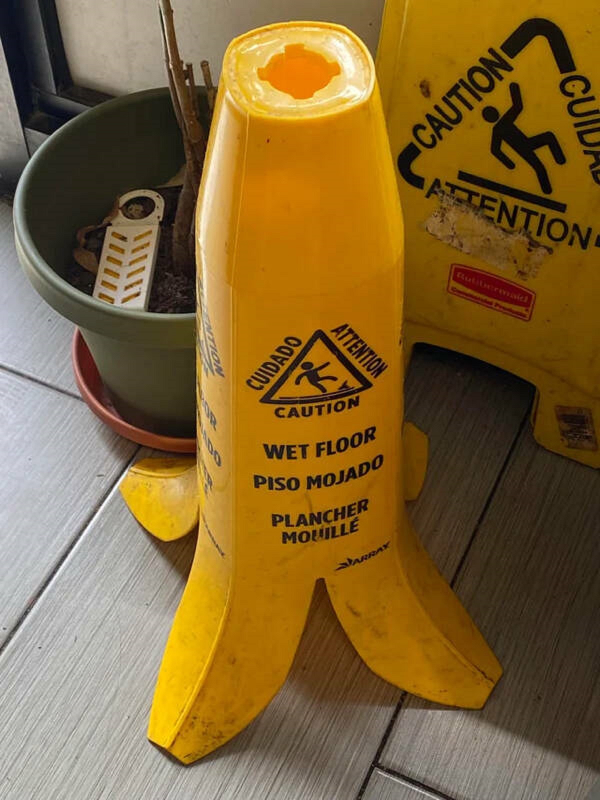 "This slippery floor sign shaped like a banana peel."