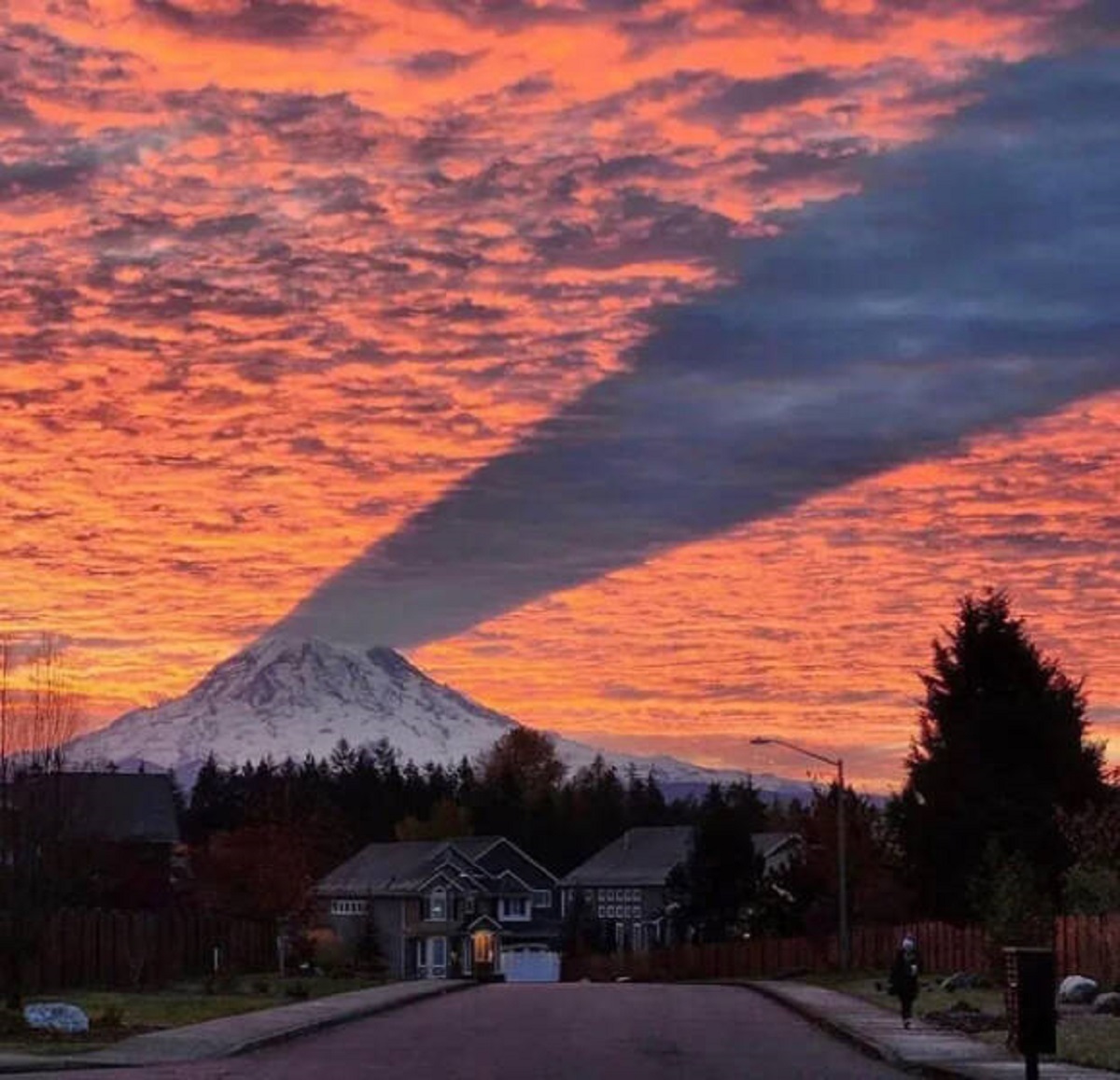 "The shadow of Mount Rainier causes a gap in the sunset."