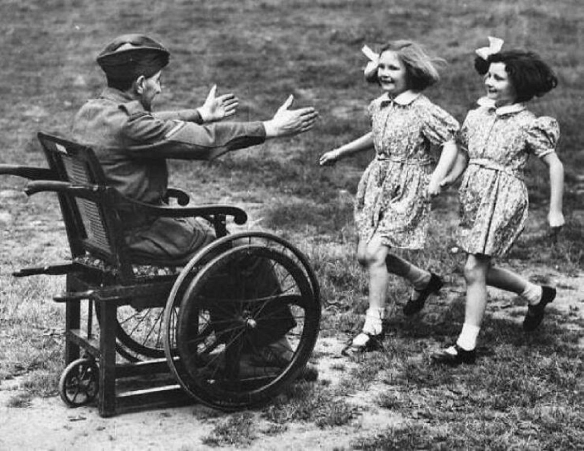 "Two Girls Greet Their Wounded Father Returning Home From War. 1940"