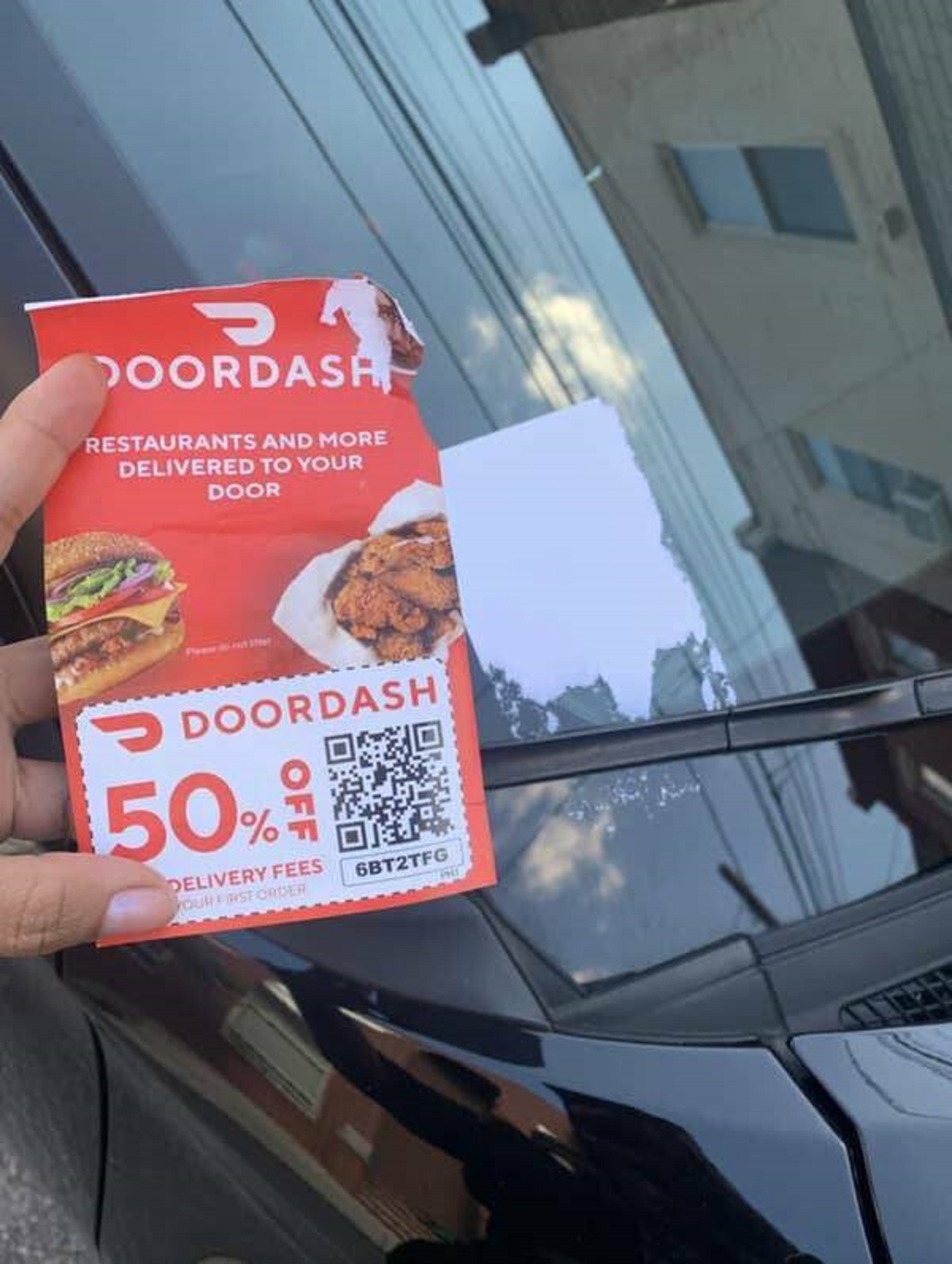 The person handing out these DoorDash coupons who said, "Here, have 50% off AND some sticky residue on your windshield that will never, ever go away!"