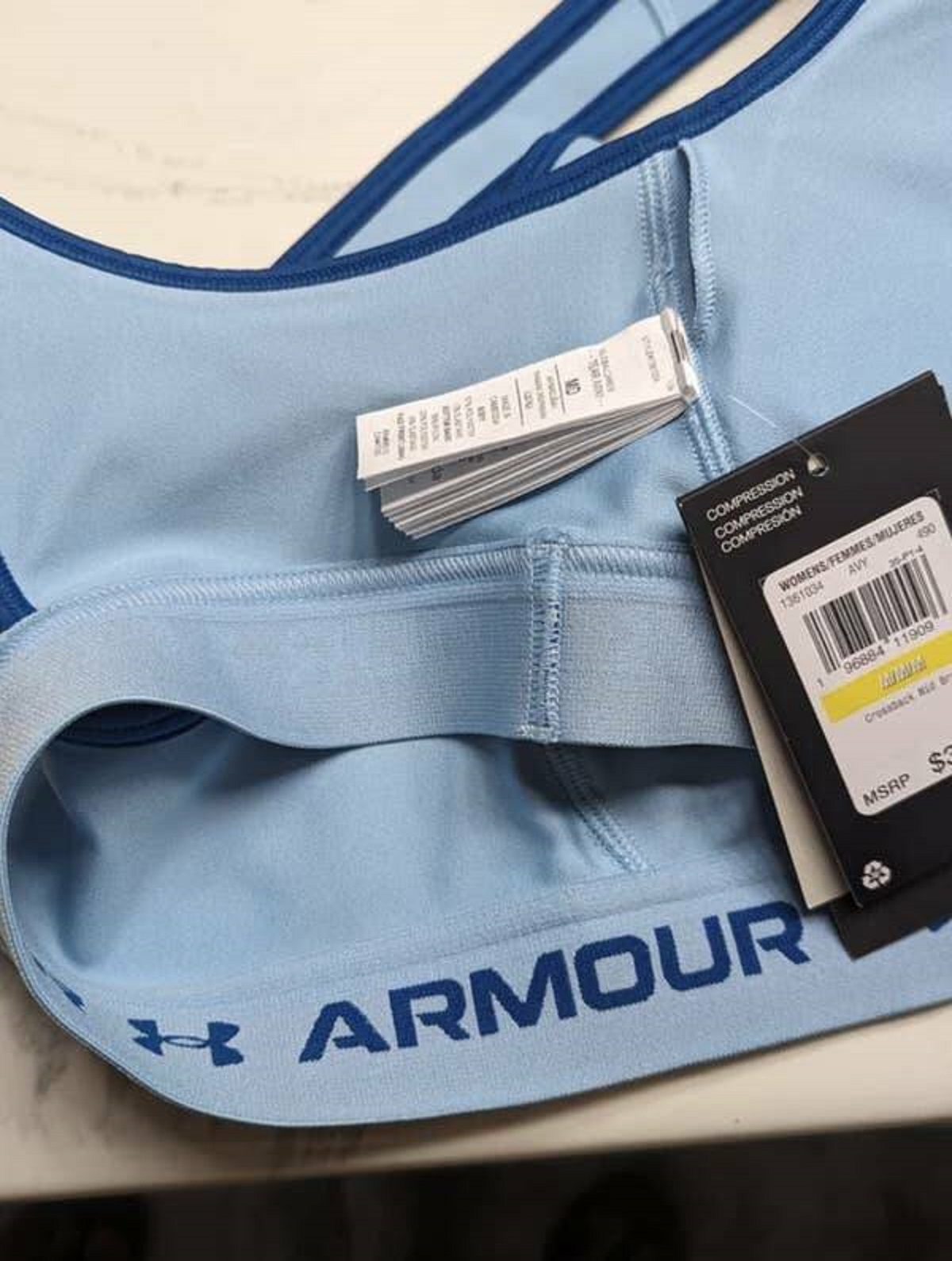 The person who thought adding 20+ tags to the inside seam of this sports bra was a perfectly sane, logical decision and would not actively make me want to burn this bra and all its dumb, itchy tags: