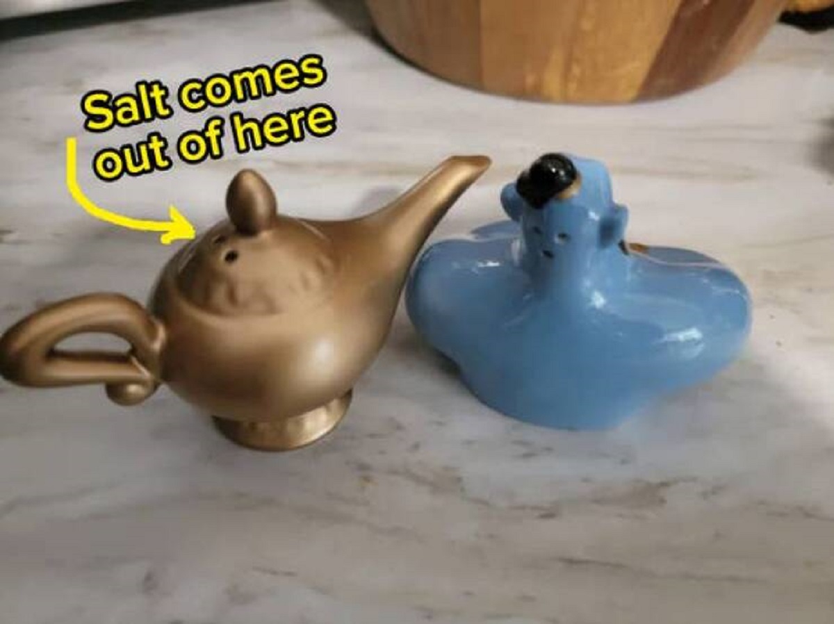 The person who designed these Aladdin-themed salt shakers, who completely missed the opportunity to have the salt come out of the spout, aka the only logical place to put it: