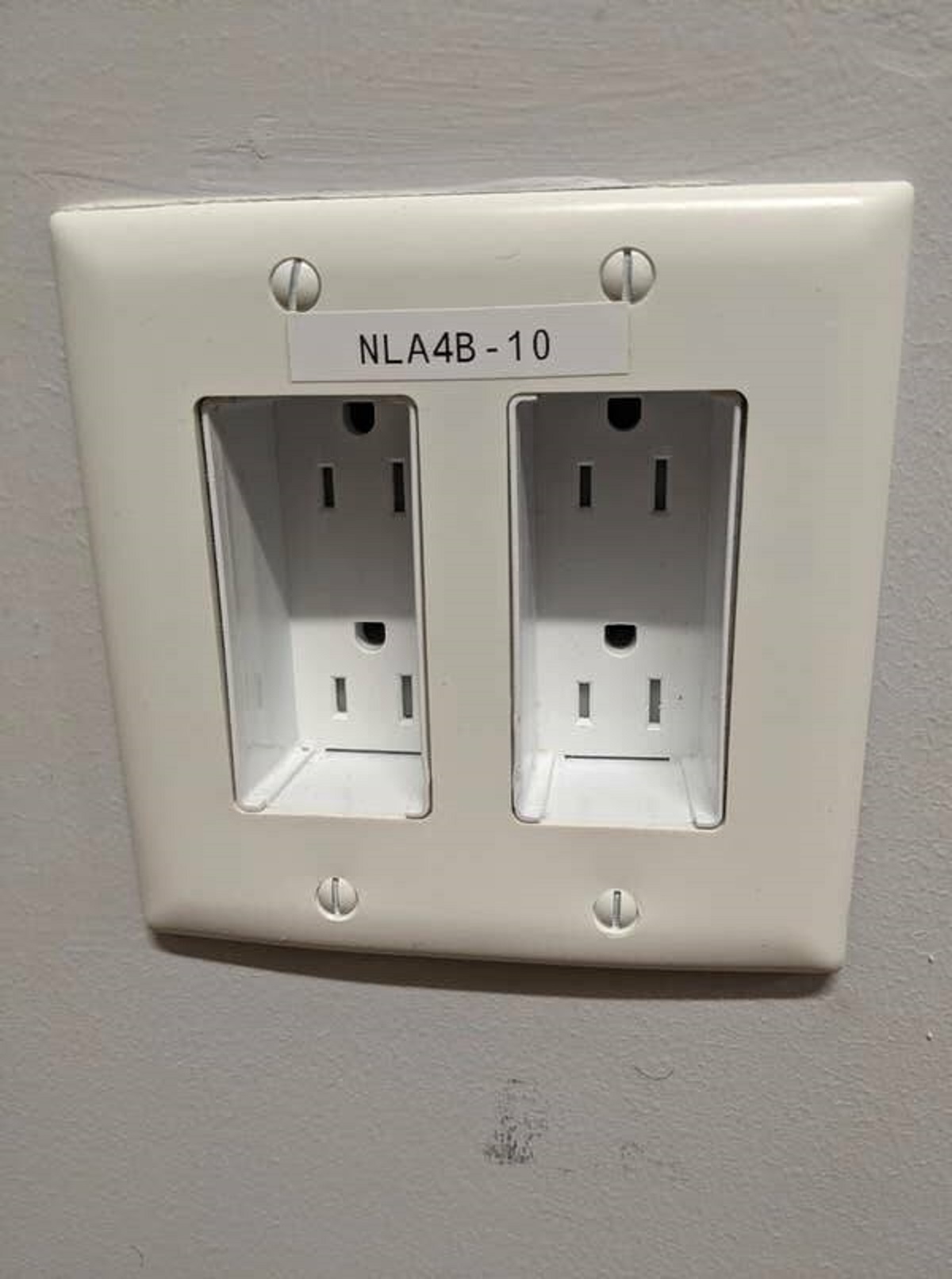 Whoever installed these outlets in this dorm room: