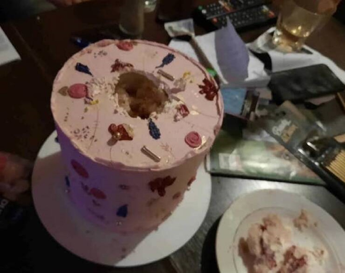 This dad who cut out the middle of this cake...