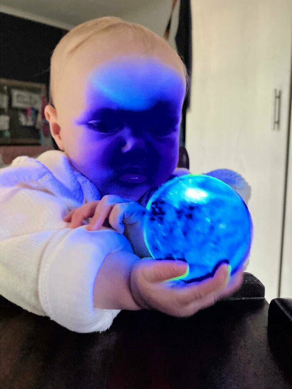 "Took A Photo Of My Baby Playing With A Light Up Ball. No Filters"
