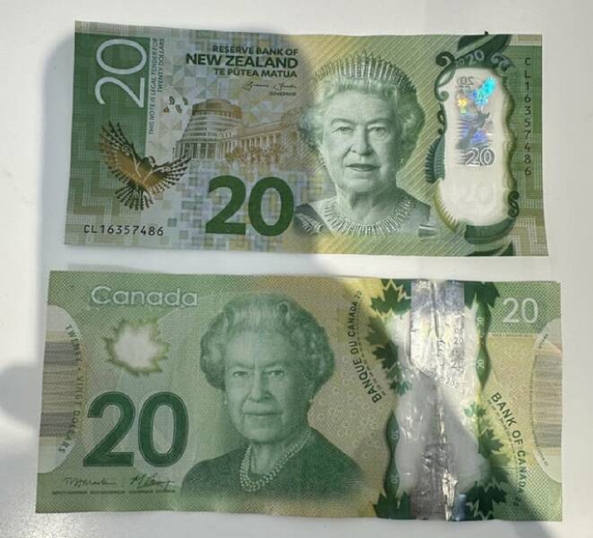 "Canadian $20 and NZ $20 bill"