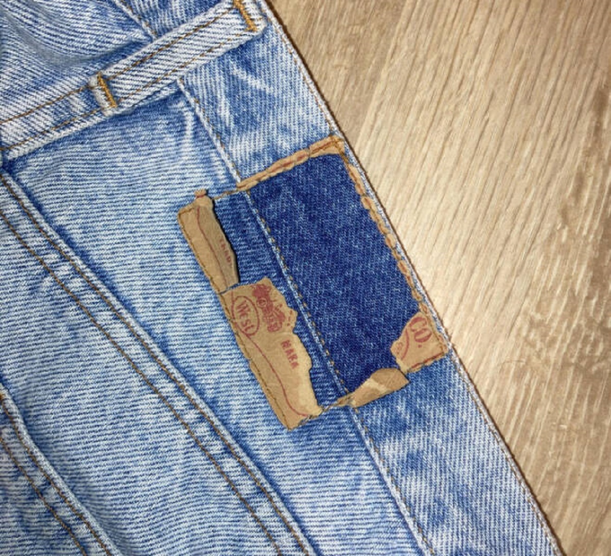 "These jeans are 30 years old. You can see their original color under the label."