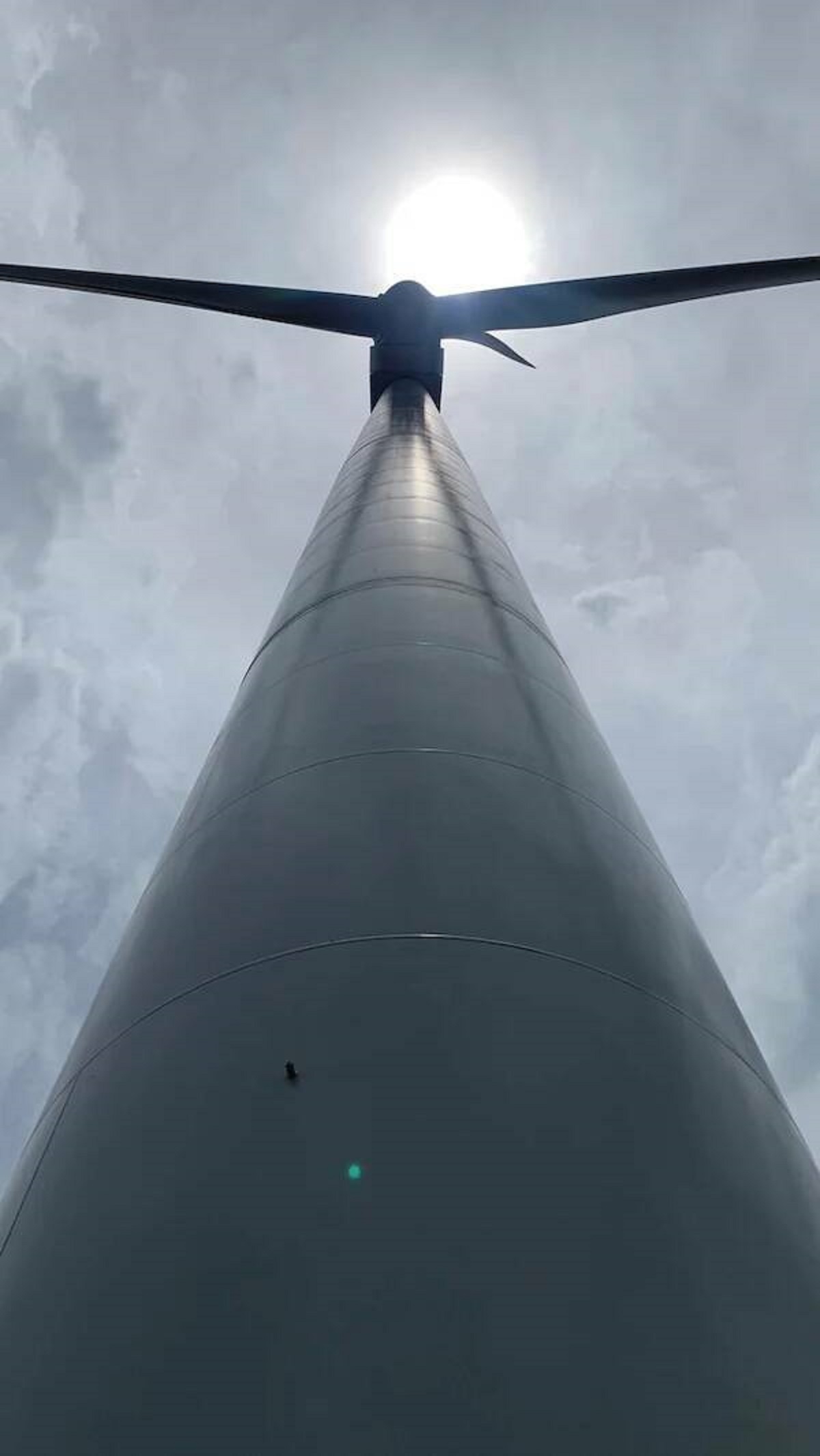 "A wind turbine photographed from it’s base."