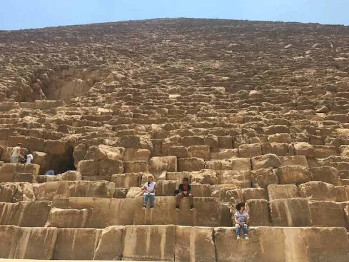 "Sitting on one of the lower rocks that made up the Great Pyramid of Giza."