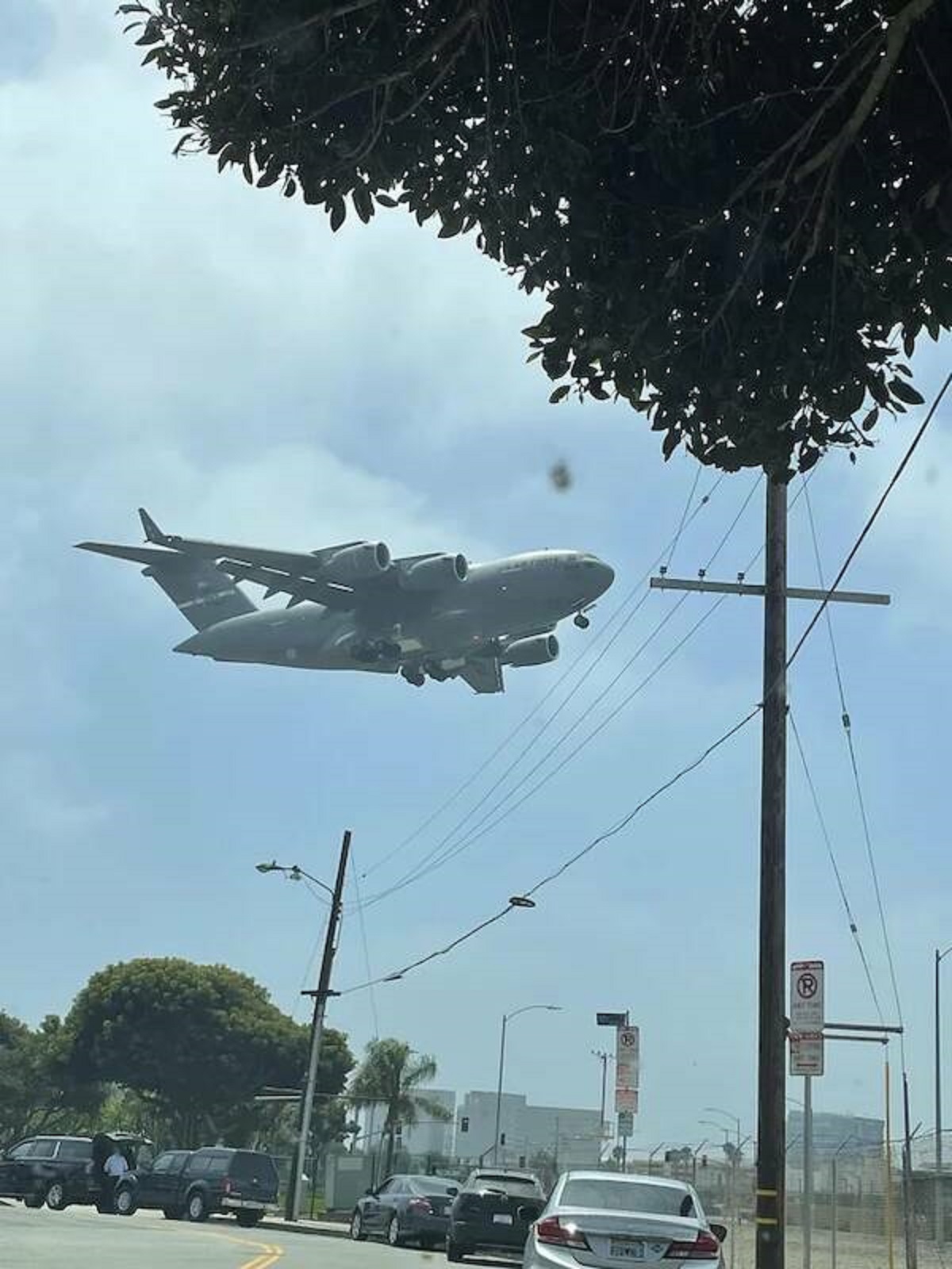 "A C-17 flying low to the ground."